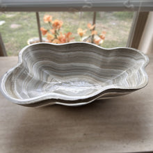 Load image into Gallery viewer, A polished and shine gray onyx stone bowl with natural patterns placed on a flat surface, likely used as a decorative centerpiece.
