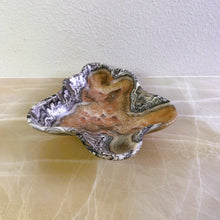 Load image into Gallery viewer, An elegant hand-carved stone bowl with capricious veins in beige and light brown tones, placed on a marble surface.
