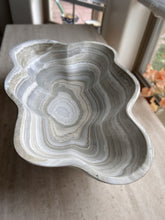 Load image into Gallery viewer, A polished and shine gray onyx stone bowl with natural patterns placed on a flat surface, likely used as a decorative centerpiece.
