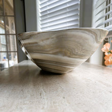 Load image into Gallery viewer, A polished and shine gray onyx stone bowl with natural patterns placed on a flat surface, likely used as a decorative centerpiece.
