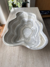 Load image into Gallery viewer, A polished and shine gray onyx stone bowl with natural patterns placed on a flat surface, likely used as a decorative centerpiece.
