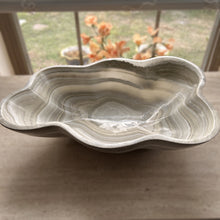 Load image into Gallery viewer, A polished and shine gray onyx stone bowl with natural patterns placed on a flat surface, likely used as a decorative centerpiece.
