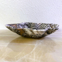 Load image into Gallery viewer, An elegant hand-carved bowl with capricious veins in beige, light brown, and dark brown tones, placed on a marble surface.
