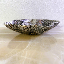 Load image into Gallery viewer, An elegant hand-carved bowl with capricious veins in beige, light brown, and dark brown tones, placed on a marble surface.

